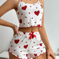 Heart print ribbed cami pajama short set worn while lounging at home