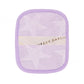 Reusable makeup remover pad in a leopard print with a satin hand strap on a plain ground