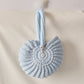 Handmade Woven Conch Shell Coin Purse | natural light styling shot
