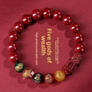 Five-Way Fortune God red beaded bracelet shown on plain background