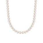 Sterling silver round bead necklace layered with a longer chain on the neckline