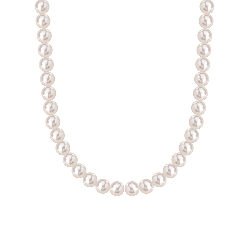Sterling silver round bead necklace layered with a longer chain on the neckline