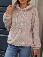 Women's plush jacquard hooded sweatshirt front view in a warm apricot tone