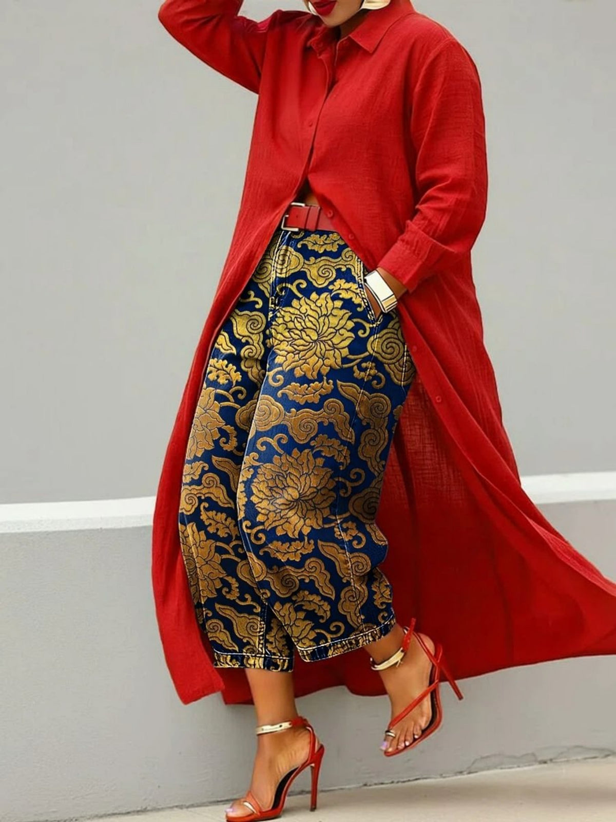 Wide leg cropped navy denim jeans with gold brocade floral print, red shirt coat and heels