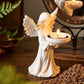 Angel tealight candle holder held in hand for scale reference