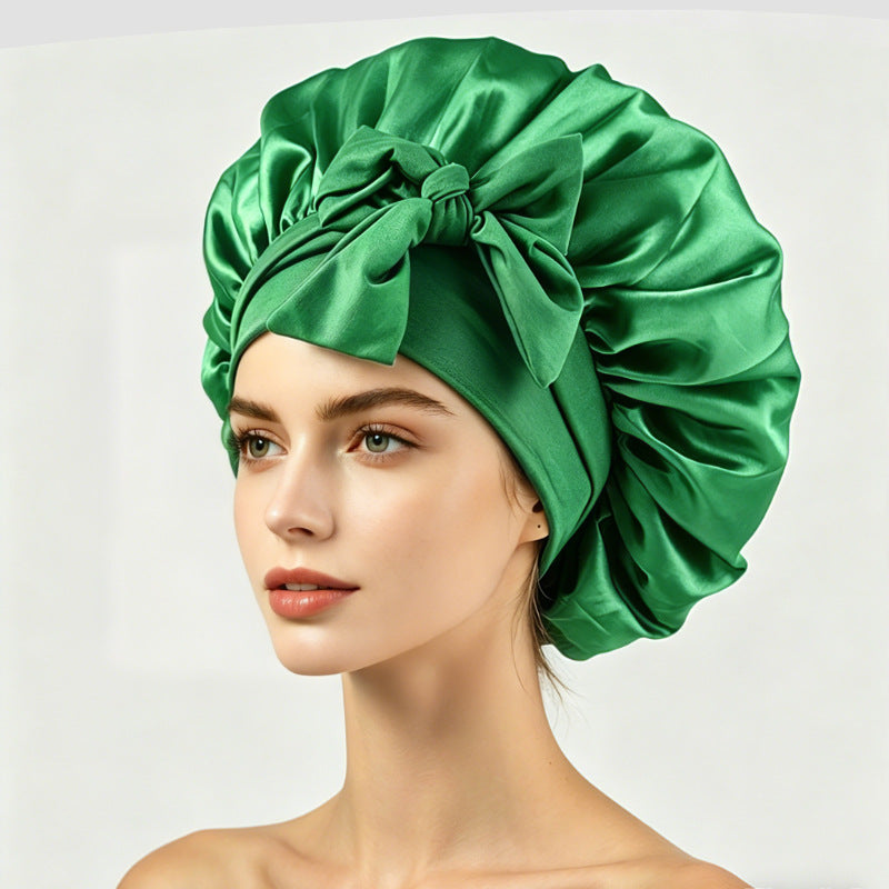 Roomy satin sleep cap with a bow tie band, one size for long or thick hair