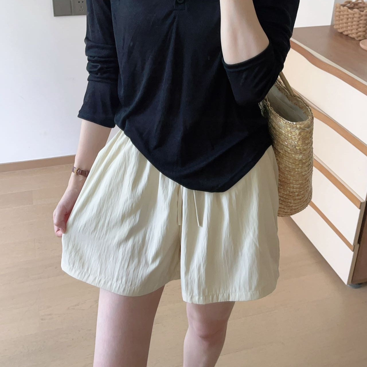 Lightweight ice silk shorts on a woman showing the relaxed above knee summer cut