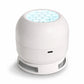 White dome shaped projector light with a honeycomb lens and a ring base, charging port on the side, on a white background