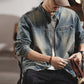 Styled shot of the mens denim jacket in Black with rolled cuffs