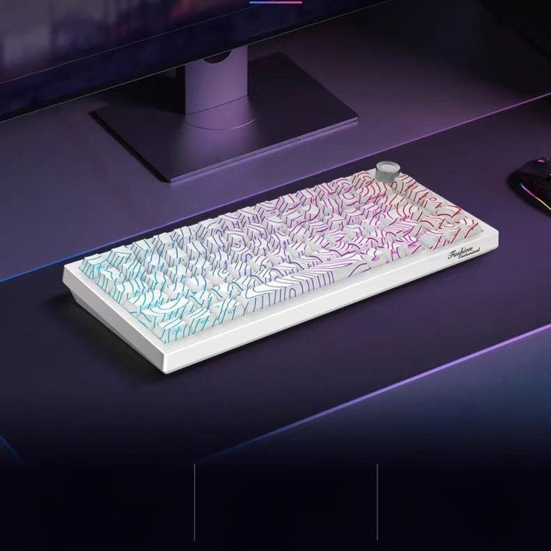 White mechanical keyboard with topographic contour keycaps and RGB glow on a desk in front of a monitor