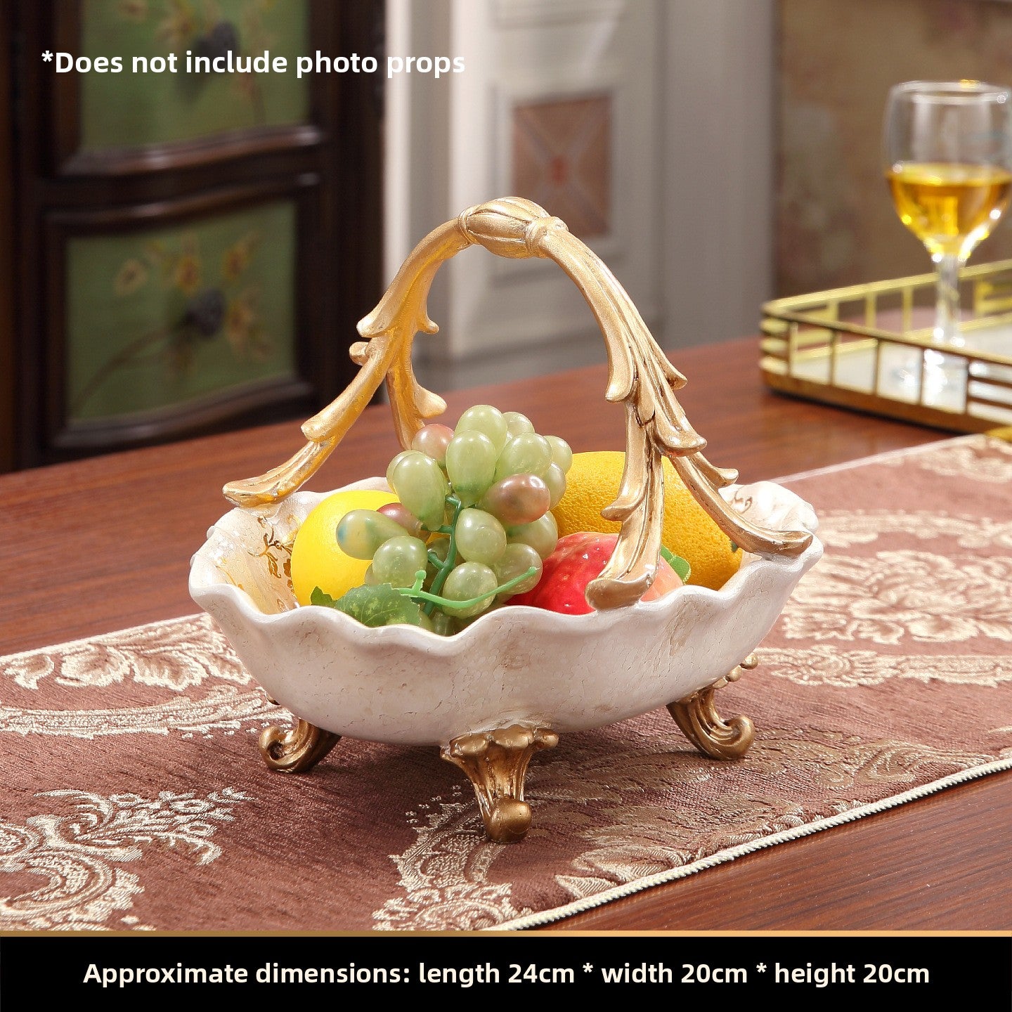 European style resin display piece with pearl shell inlay and gilt scrollwork on a tabletop scene