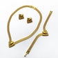 Imitation gold three-piece jewelry set worn together as a coordinated styled look