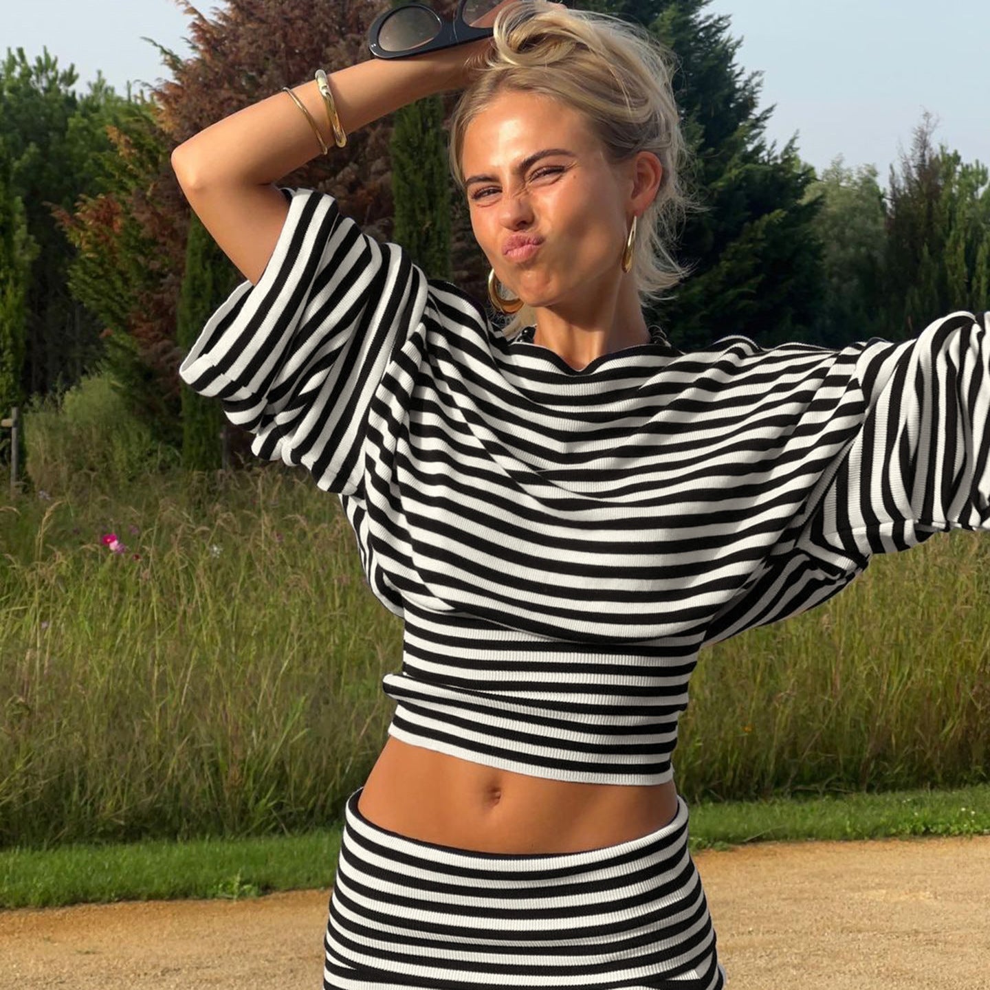 Close up of the black and white stripe knit on the Bat Sleeve Top and Skirt Set