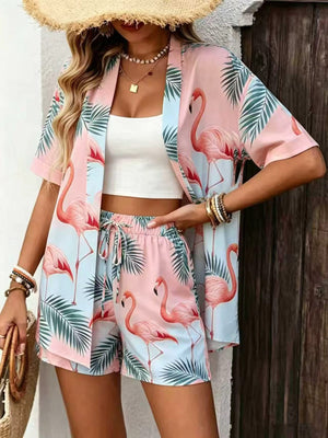 Women's pink flamingo print two piece set with an open front short sleeve cardigan and shorts on a model