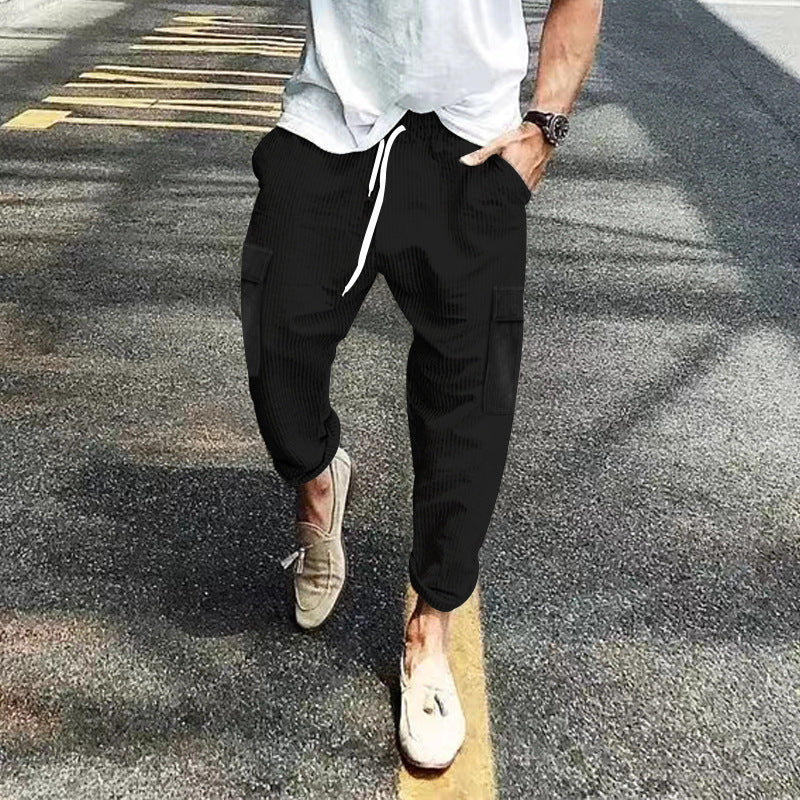 Black ribbed corduroy pants with drawstring waist and thigh pockets, photo used for the Black XXXL option