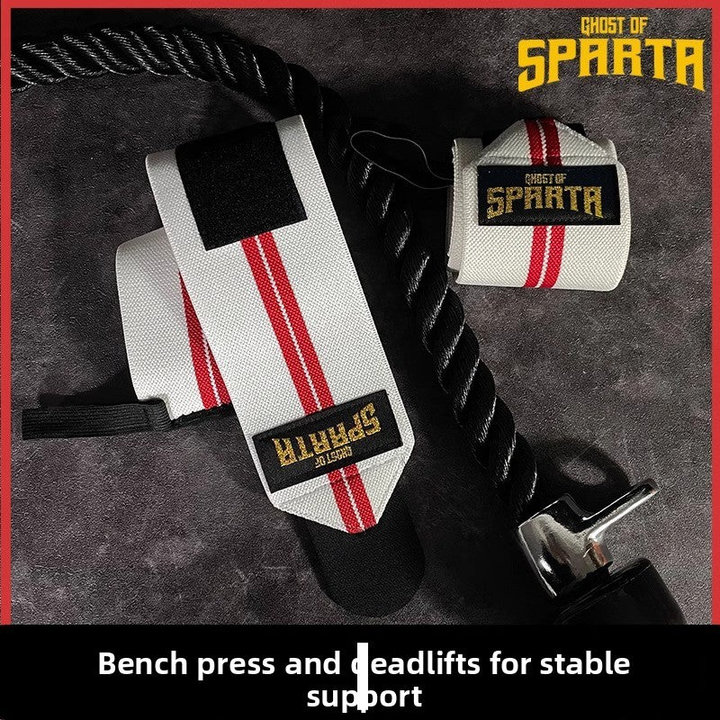 White and red elastic wrist wraps, one rolled and one unrolled flat on a dark mat
