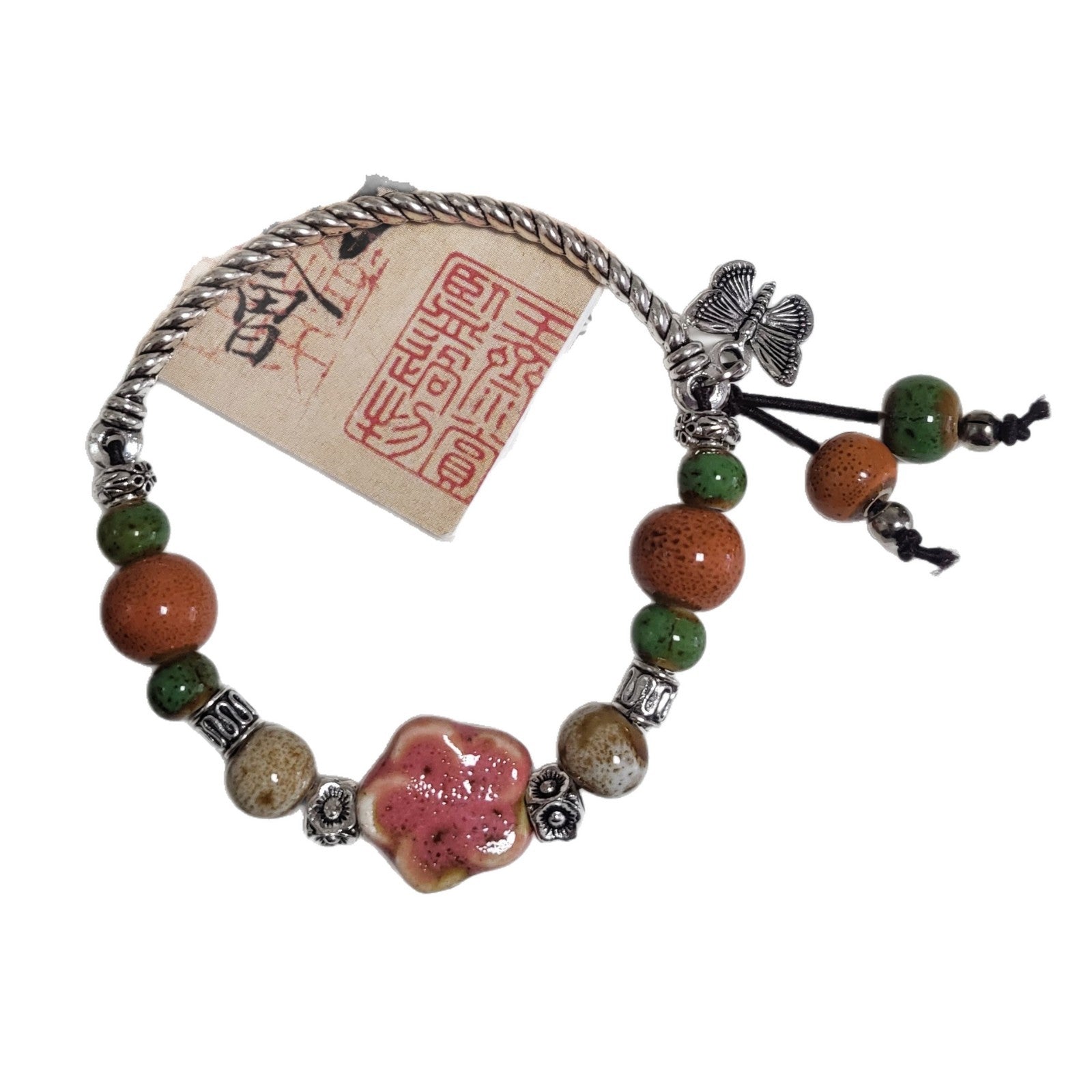 Ceramic beads strand held in hand showing the size of each clay bead