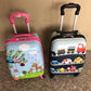 Side view of kids hardshell trolley suitcase showing zip closure and lock latch