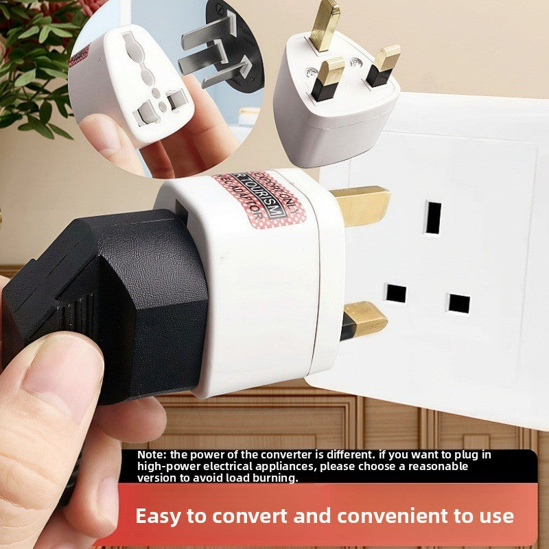 Universal to UK type G travel plug adapter shown fitted into a wall socket