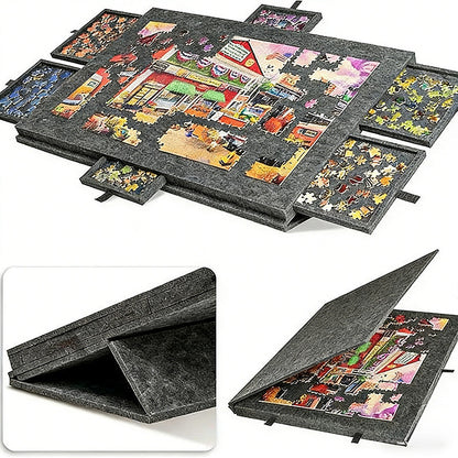 Dark gray felt jigsaw puzzle board with six open sorting drawers around a puzzle in progress, with folded views below