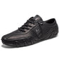 Black microfiber low-top lace-up casual shoe with a wavy cream lug sole, three quarter view, size option 48