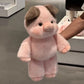 Soft plush animal toy next to a hand to show its size and scale