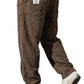 Close view of the deep vertical corduroy wales woven into the soft trouser fabric