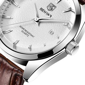 Close up of a BENYAR quartz watch white dial with date window and brown leather strap