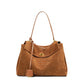 Suede leather tote bag shown with daily essentials for size reference