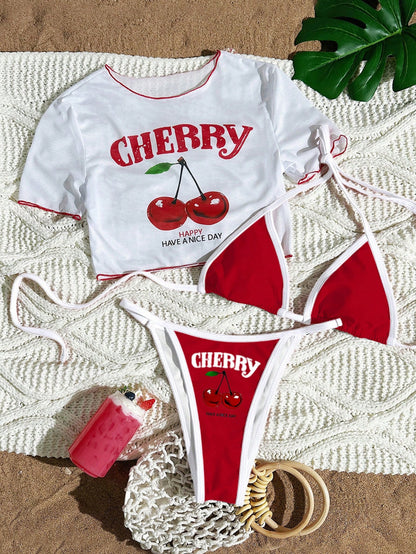 Cherry print bikini set in white with red binding, mesh tee, triangle top and tie side bottom