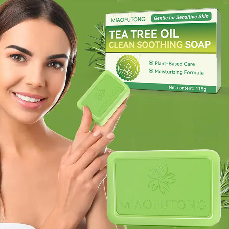 Tea tree soap bar resting on a draining dish beside a bathroom sink