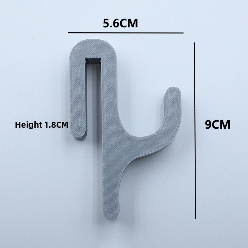 Gray resin single hook with size marks, 5.6 cm wide and 9 cm tall, seen from the front on a light background