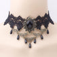 Vintage lace choker necklace displayed on a neck form against a plain backdrop