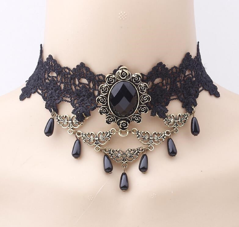 Vintage lace choker necklace displayed on a neck form against a plain backdrop