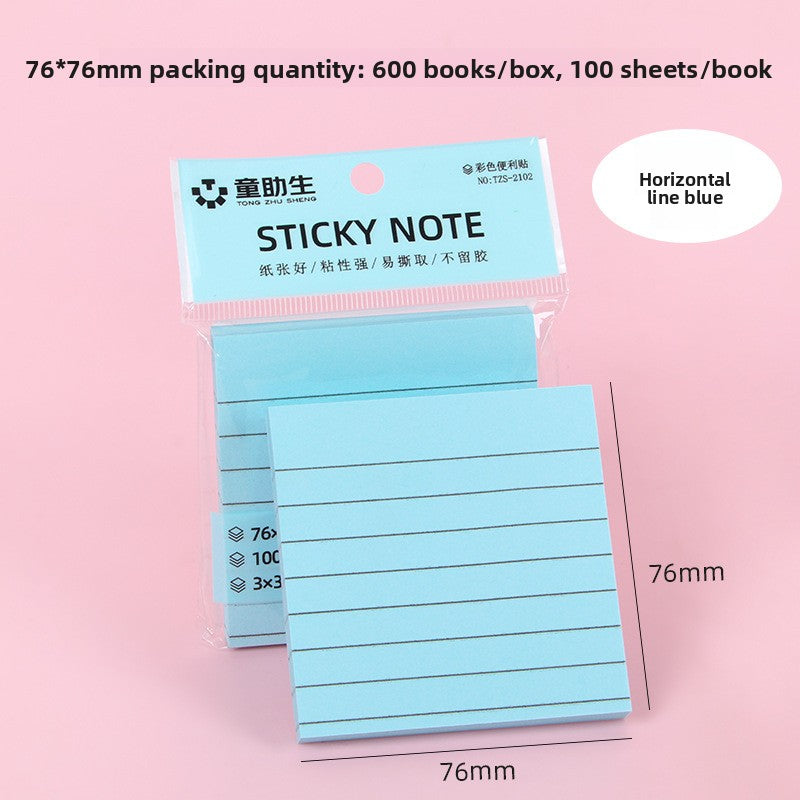 Yellow ruled sticky note pad with horizontal lines shown at an angle on pink background