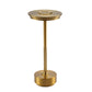 Gold table lamp with a flat disc shade, knurled stem band and round base on a white background