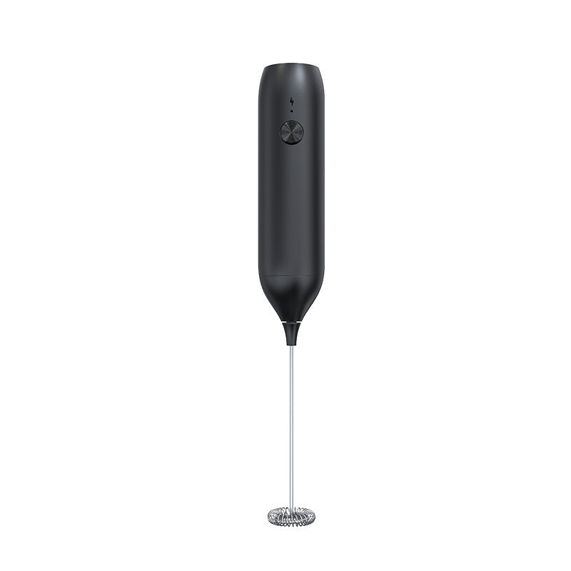 Black handheld electric milk frother with round power button and spring whisk on a plain background