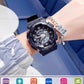 Watch on a bedside table next to a small night lamp