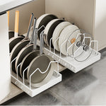 White carbon steel pot rack holding pans, lids and plates upright inside a kitchen cabinet
