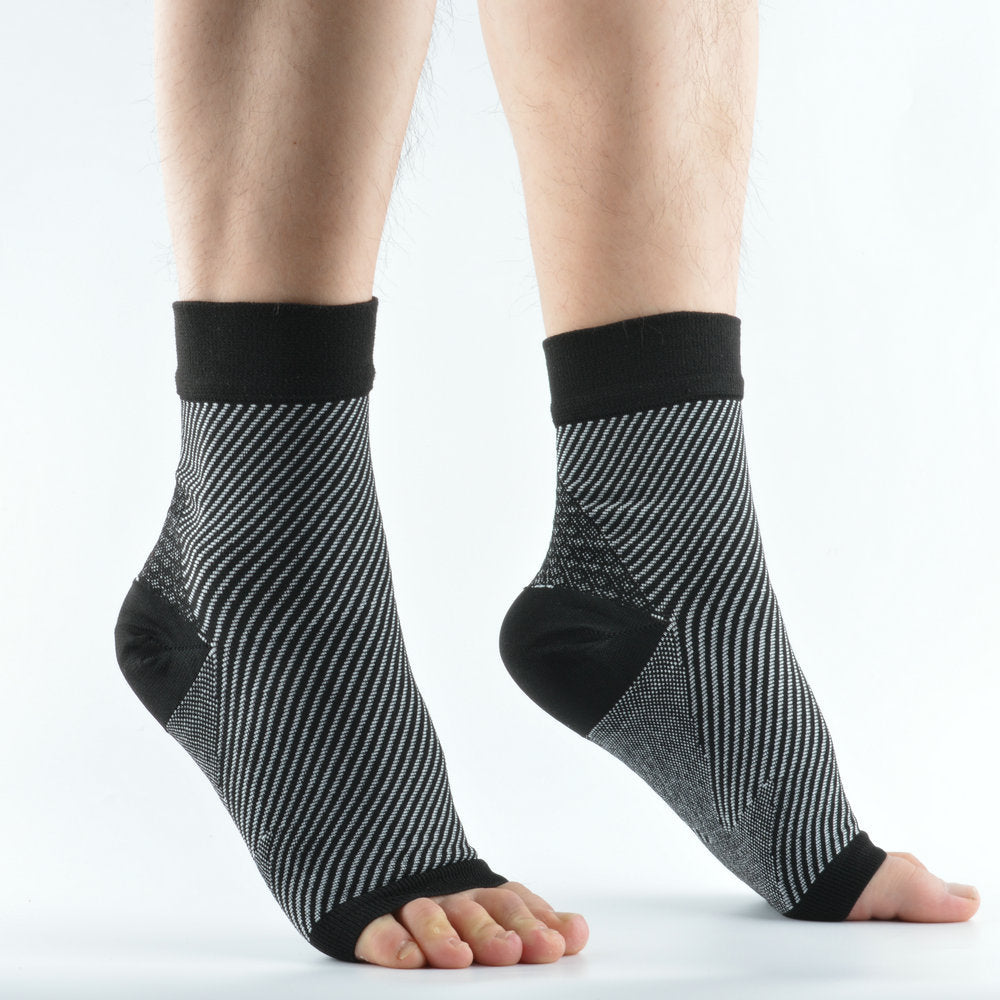Black and grey pinstripe knit compression ankle sleeves worn on both feet, rear view, open heel and toe