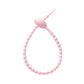 Soft silicone tadpole cable tie coiled into a loop to show the reusable cinch closure