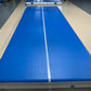 Blue inflatable air track mat with a white center stripe laid flat on a floor, 10 x 2 x 0.2 m option photo