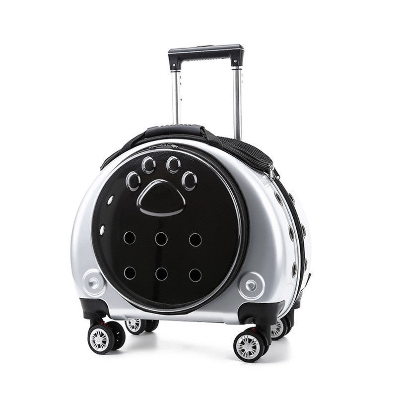 Silver pet carrier on wheels with a black paw-print window pierced with air holes and a telescopic handle