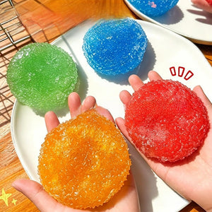 Hand holding a yellow textured squeeze ball that dents softly under the fingers