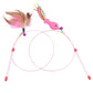 Feather tuft cat teaser wand beside a pink fish and ribbon wand, both on coiled steel wire