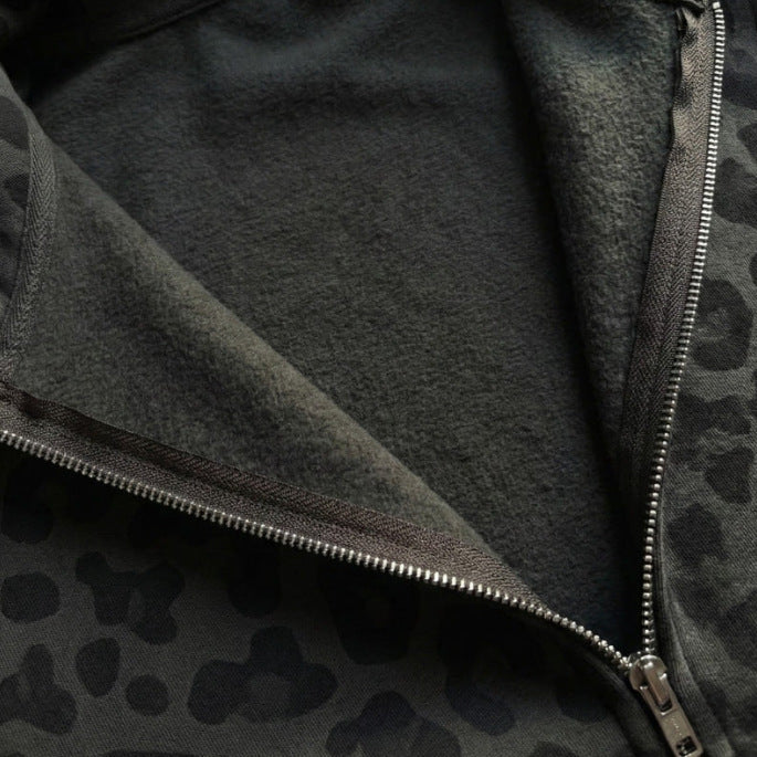 Close up of the metal zip and brushed fleece interior of the leopard print hoodie