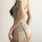 Side angle of the khaki women's dress showing its gentle draping fit