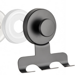 Black stainless steel suction cup razor holder with a slotted rack beside a clear suction cup
