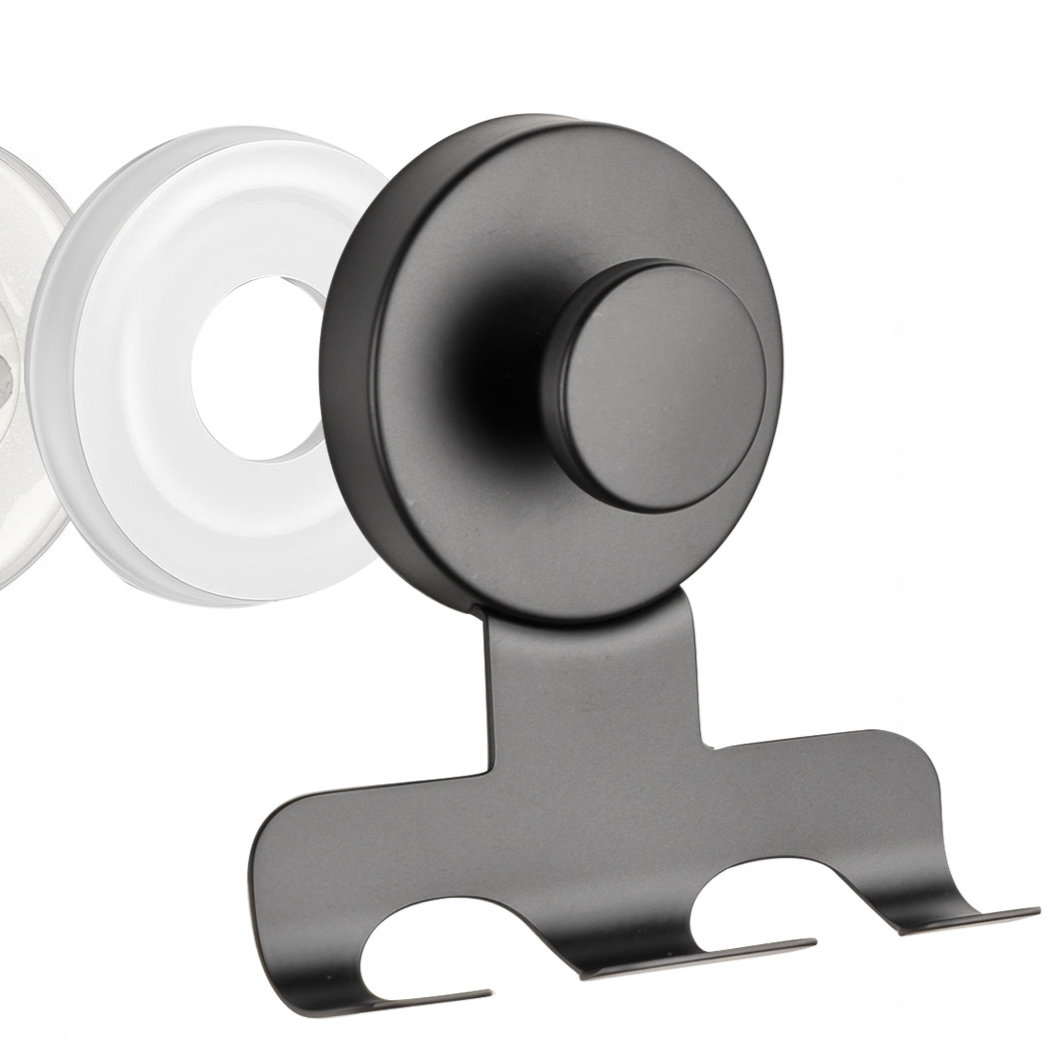 Black stainless steel suction cup razor holder with a slotted rack beside a clear suction cup