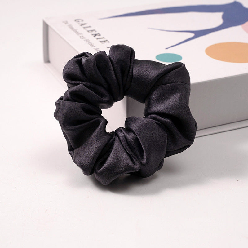 Light blue satin scrunchie with white polka dots